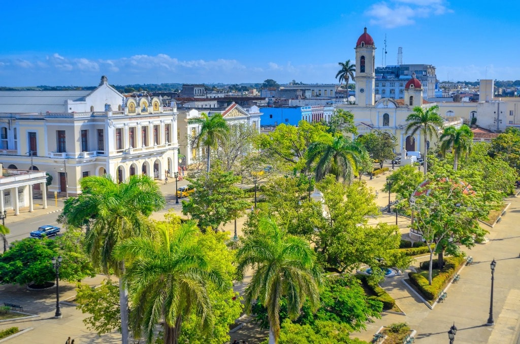 Cienfuegos colonial plaza with palm trees and cathedral