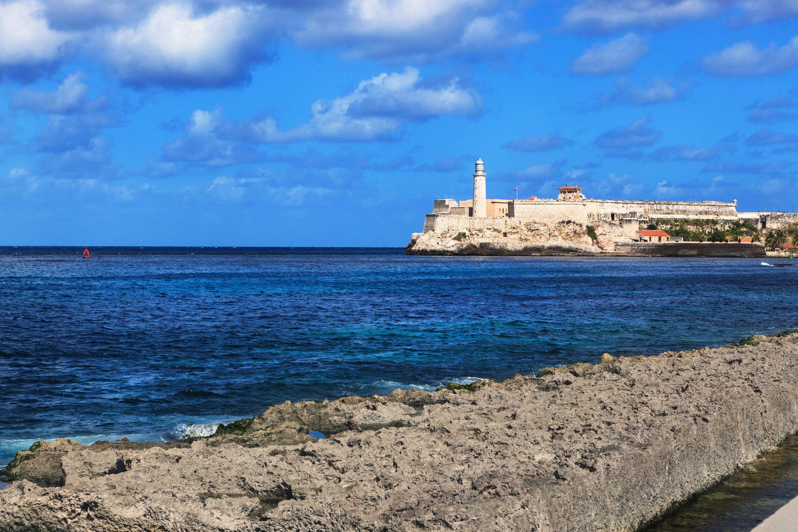 Cuba coastal fortress and lighthouse over turquoise water