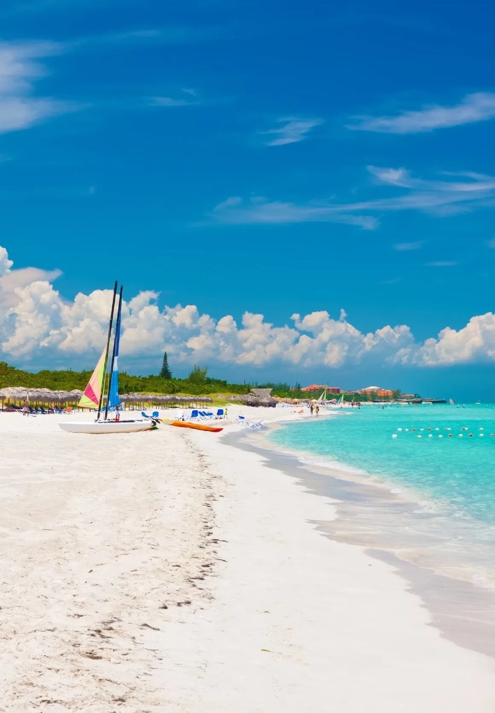 Varadero Cuba beach with sailboat and turquoise water