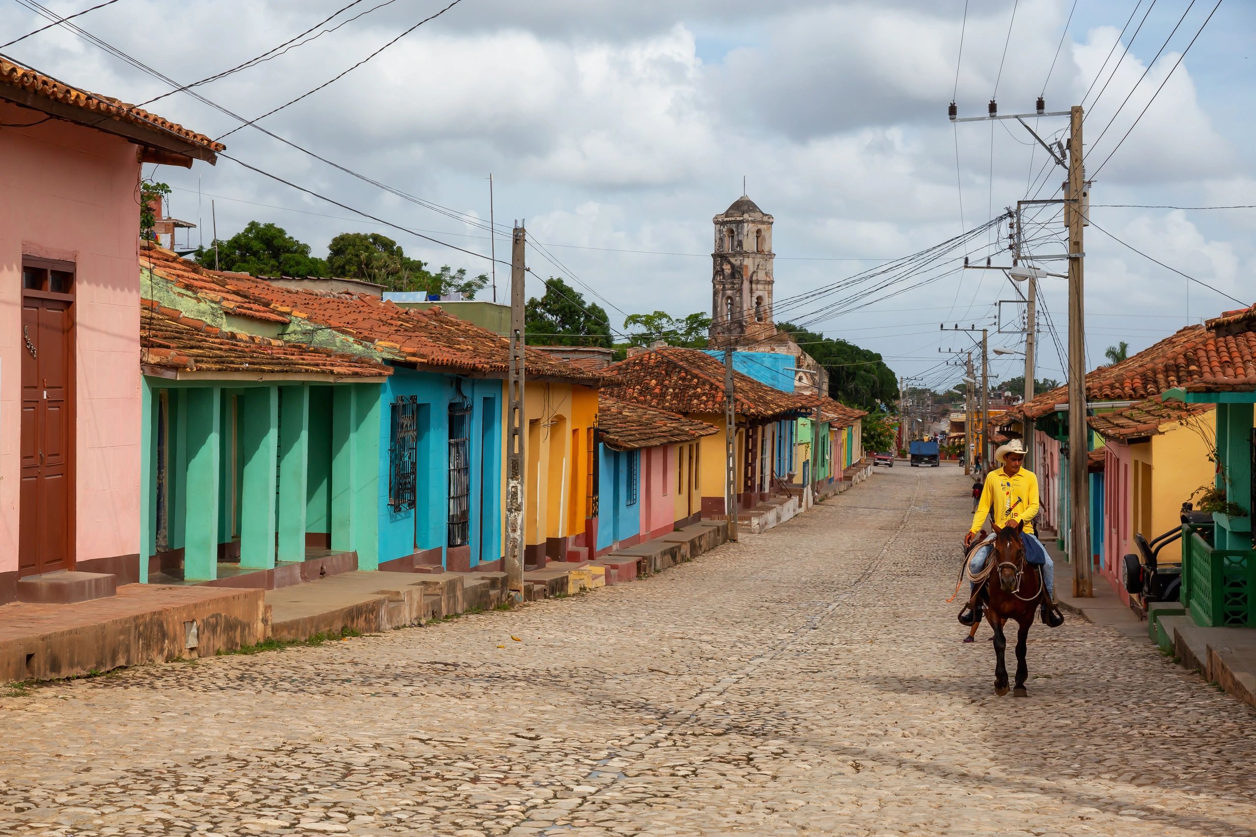 Trinidad Cuba cobblestone colonial street with pastel buildings