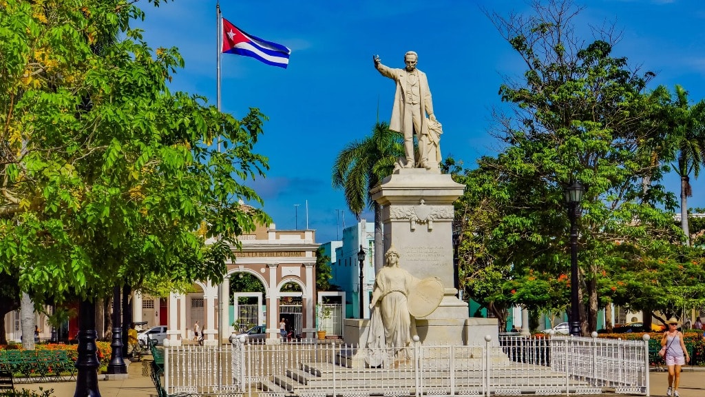 José Martí monument with Cuban flag Cienfuegos plaza