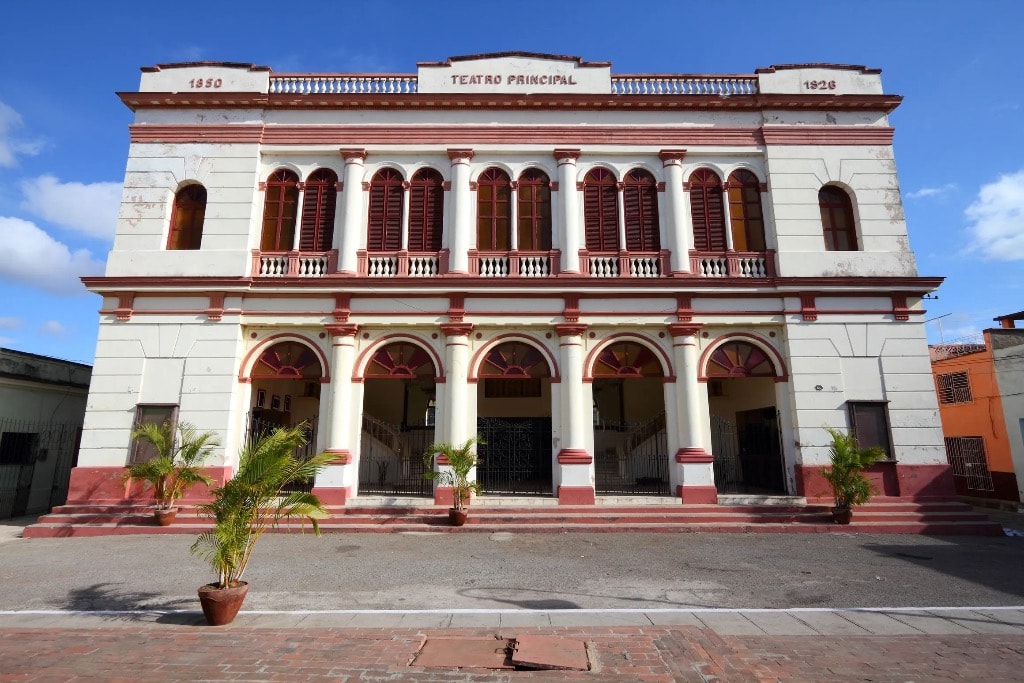 Teatro Principal colonial theater facade with arched colonnades red and white Cuba