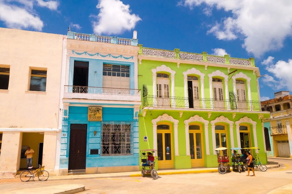 Colorful colonial buildings on a vibrant Cuban street scene