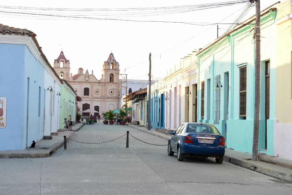 Colorful colonial street with church facade, Cuba